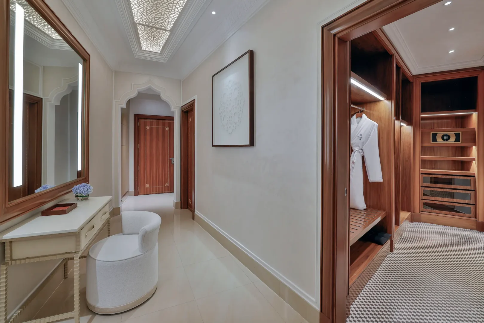 waldorf astoria ras al khaimah two queen beds deluxe room wardrobe detail with built in storage and refined interior design