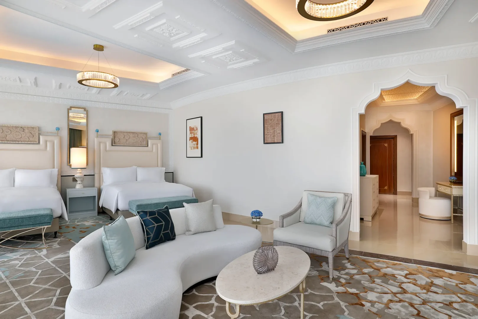 waldorf astoria ras al khaimah two queen beds premier golf course view room interior with elegant design overlooking the greens