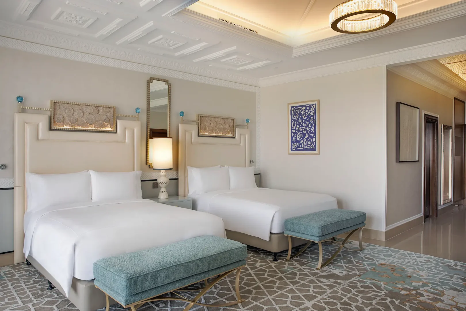 waldorf astoria ras al khaimah two queen beds premier golf course view room overview featuring double beds and views of the greens