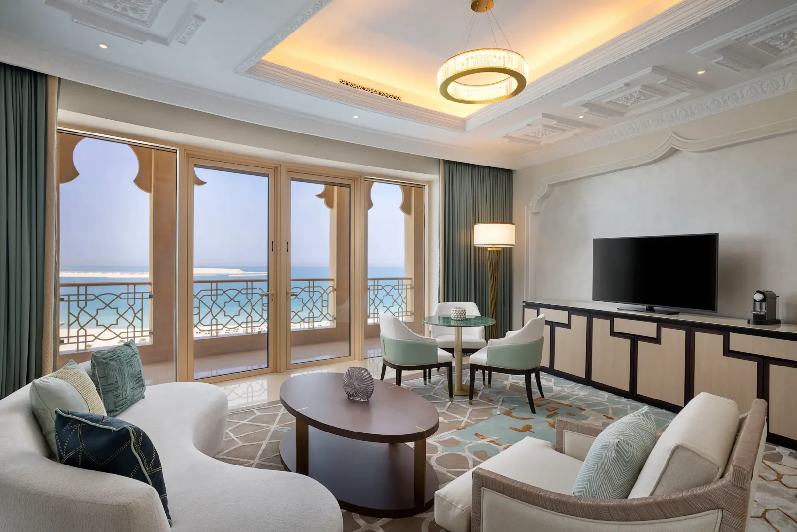 waldorf astoria ras al khaimah two queen beds premier ocean view room living area with comfortable lounge seating and ocean ambiance