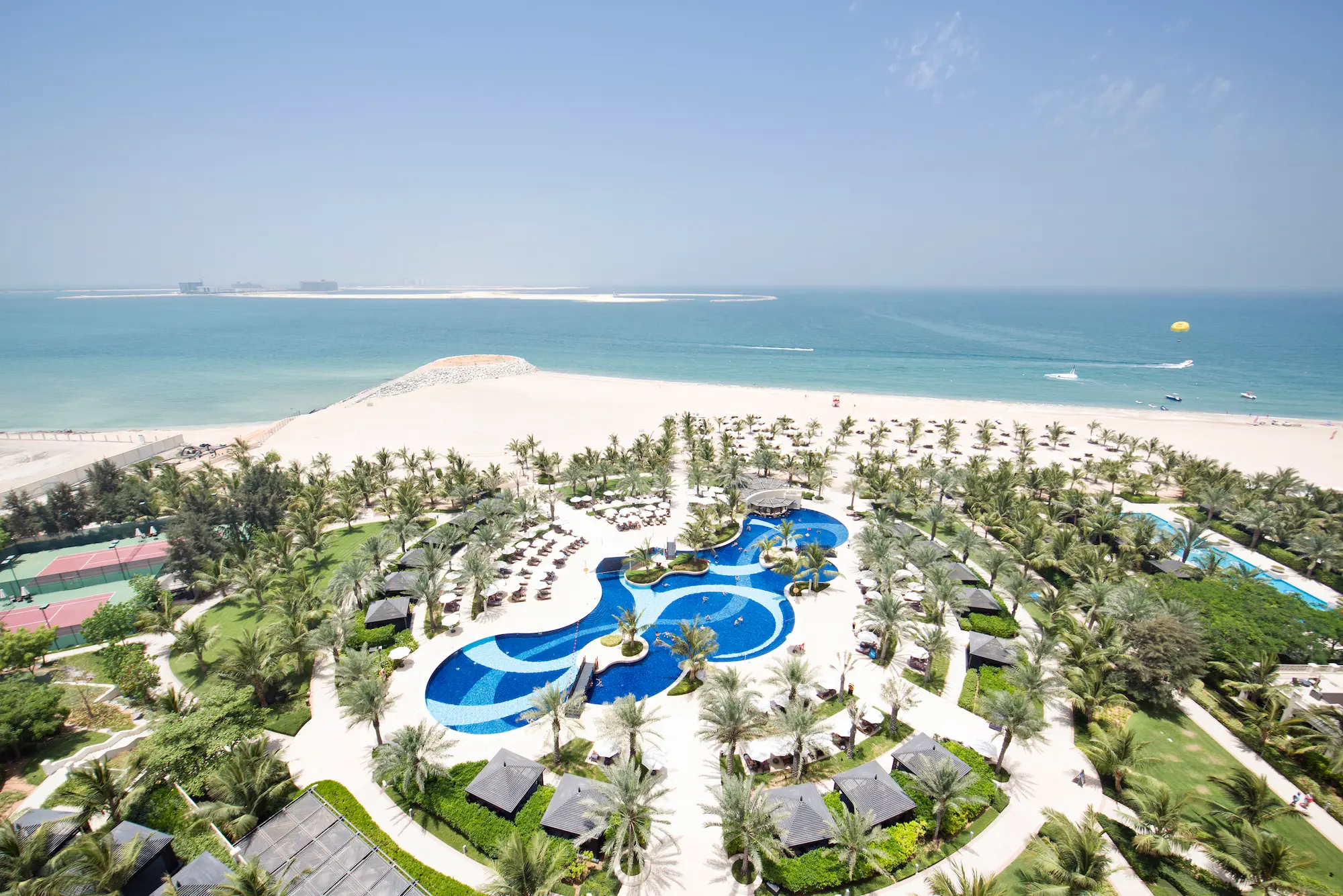 waldorf astoria ras al khaimah waldorf astoria areal azure pool showcasing a relaxed poolside setting with refined resort ambience