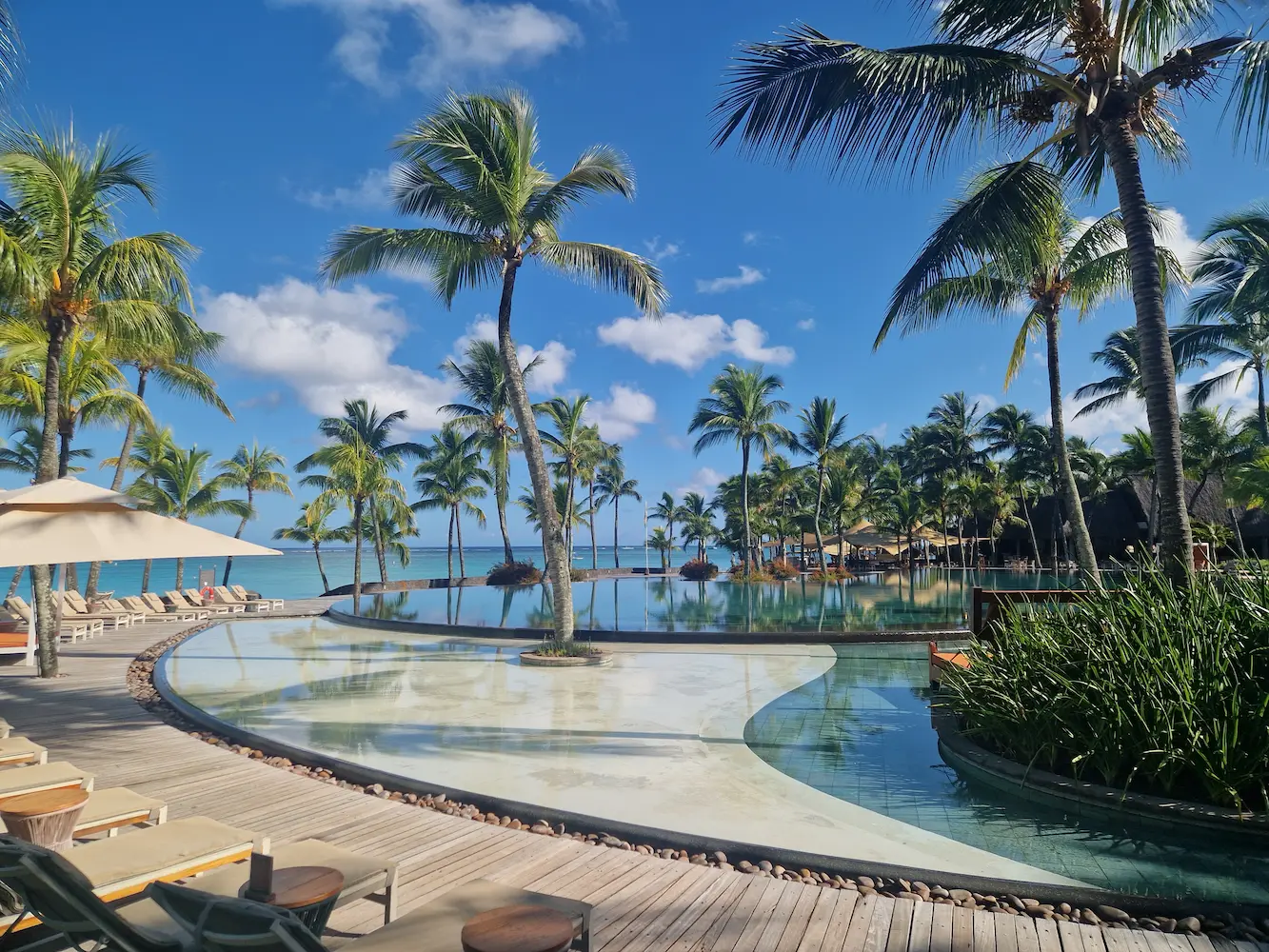 beachcomber trou aux biches resort visiting tropical garden and beach scene with lush greenery and white sand