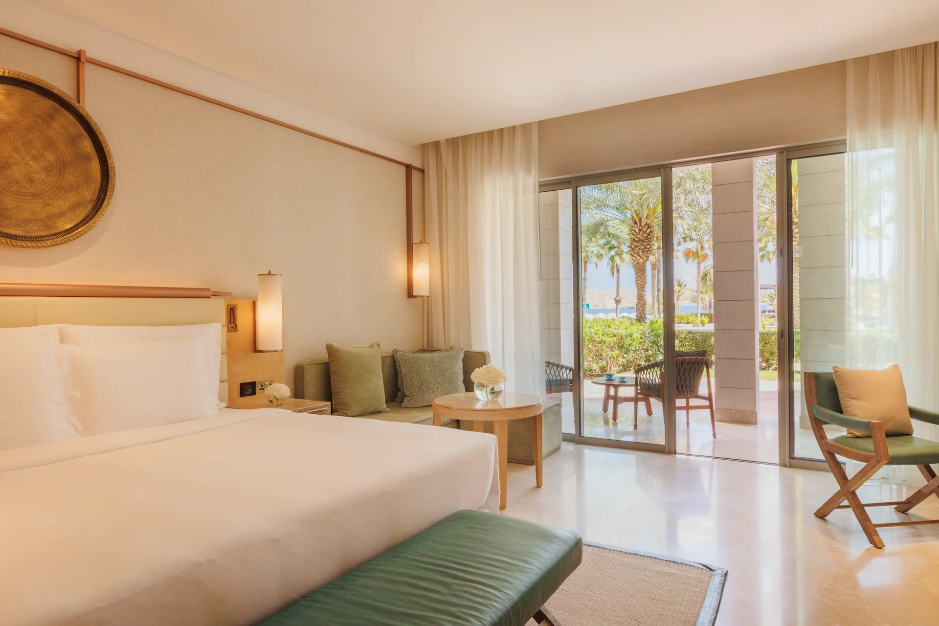 garden deluxe room at jumeirah muscat bay oman with views of landscaped gardens and elegant modern resort interiors