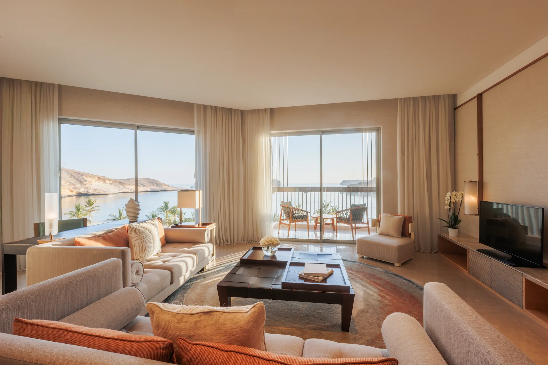 one bedroom panoramic suite at jumeirah muscat bay oman with expansive sea views spacious living area and luxury resort interiors