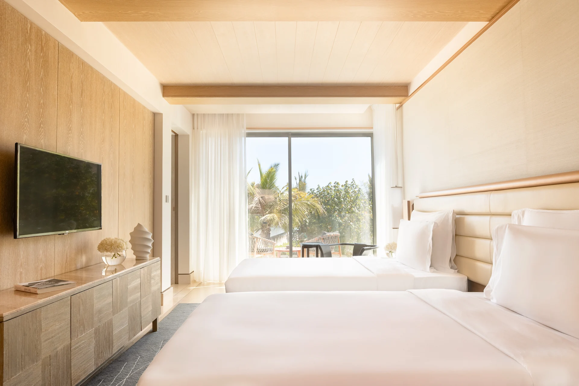 summerhouse with garden pool twin beds at jumeirah muscat bay oman with private garden terrace and pool access in a luxury resort setting