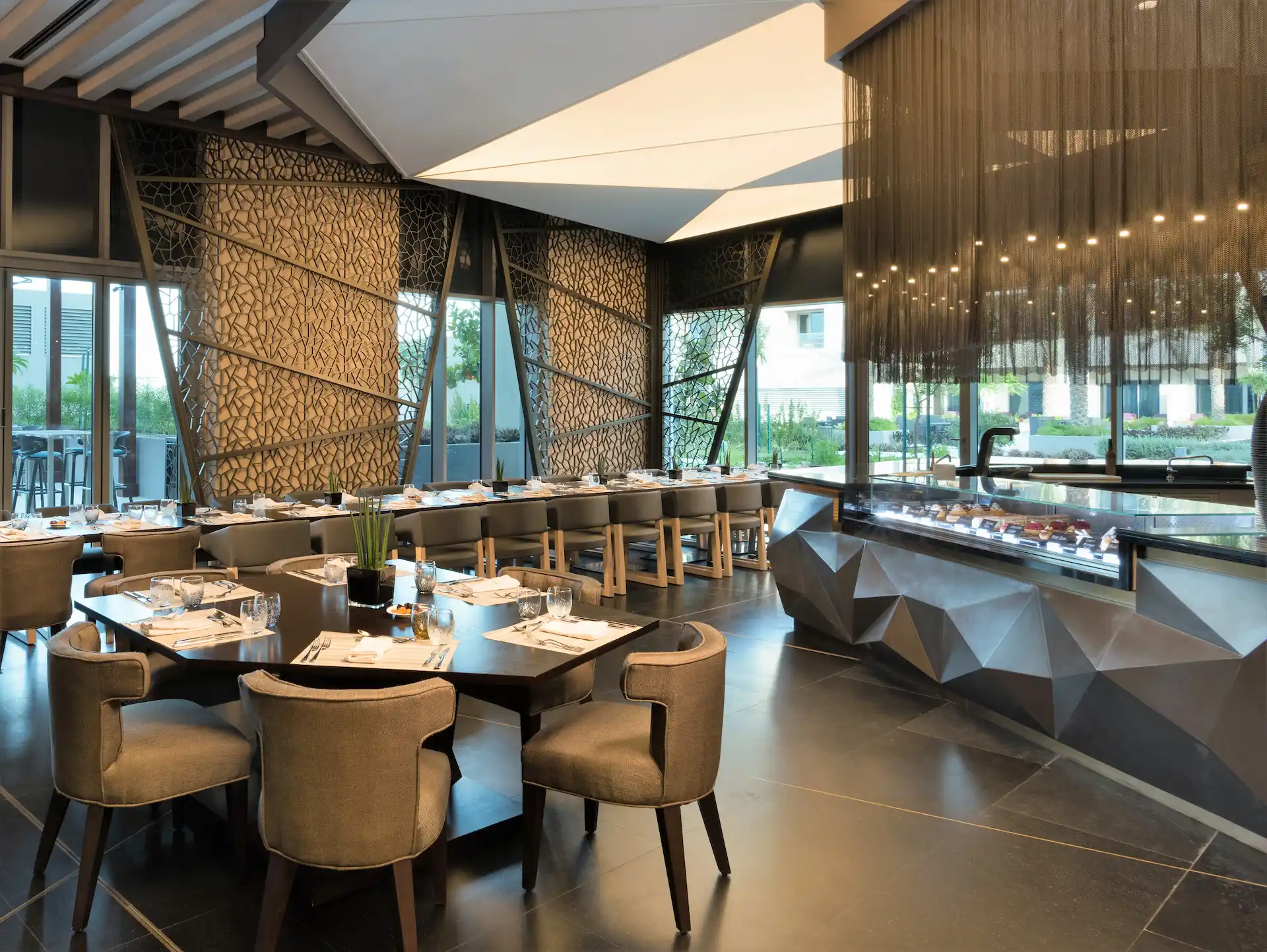 kempinski hotel muscat oman cafe one restaurant dining area buffet seating modern hotel cafe interior breakfast lounge