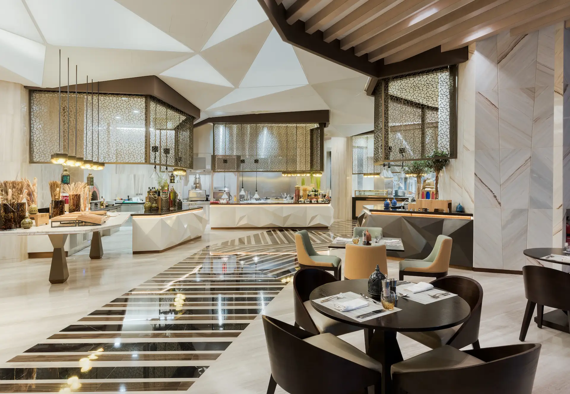 kempinski hotel muscat oman the kitchen restaurant buffet dining live cooking stations modern hotel interior cuisine display