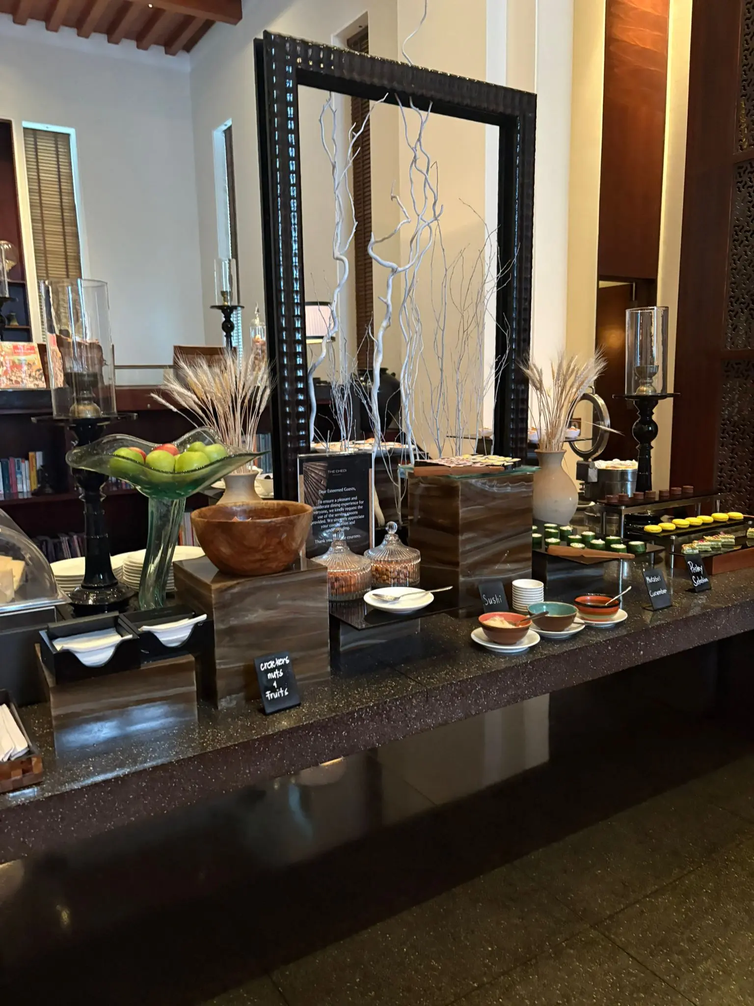 the chedi muscat dining experience with luxury cuisine presentation and elegant restaurant setting