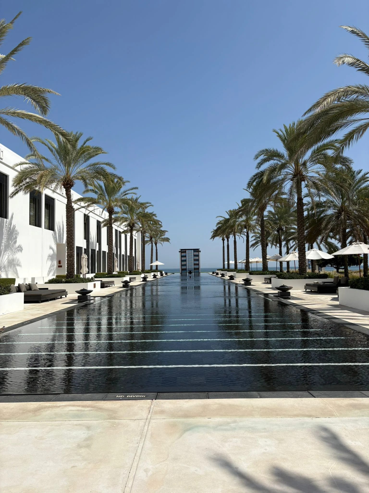 the chedi muscat relaxing luxury stay with serene resort setting and elegant architecture