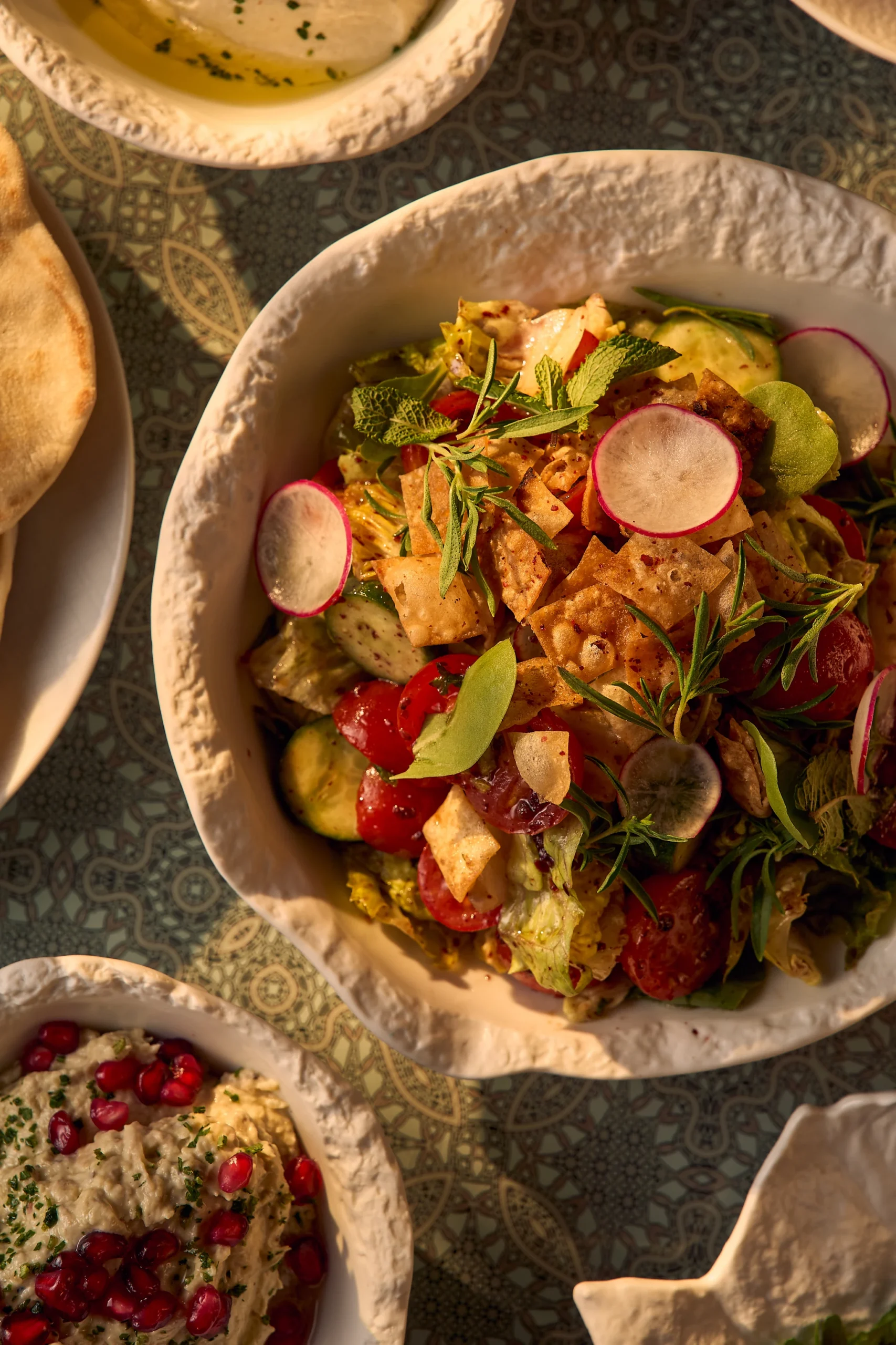atlantis the palm ayamna food salad featuring fresh middle eastern flavours, vibrant presentation and elegant dining setting in dubai