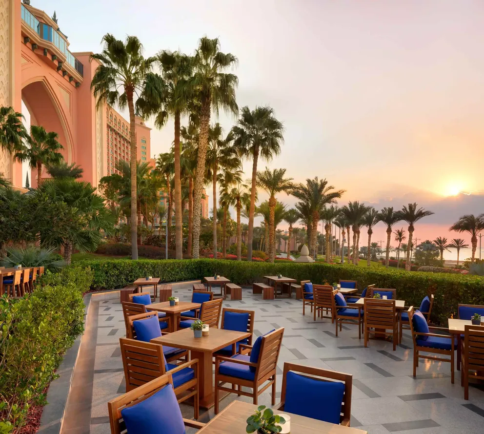atlantis the palm imperial club room terrace with stylish outdoor seating, elegant design and elevated views across dubai skyline
