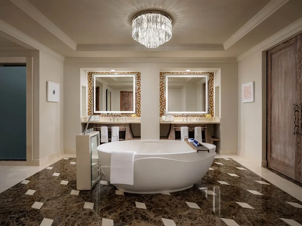 atlantis the palm regal suite bathroom with luxurious marble finishes, spacious layout and refined design overlooking dubai skyline