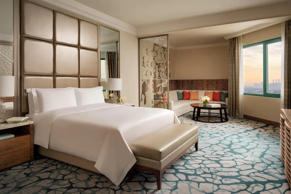 atlantis the palm regal suite king bedroom with spacious layout, plush king bed and elegant interiors overlooking dubai skyline in a refined luxury setting