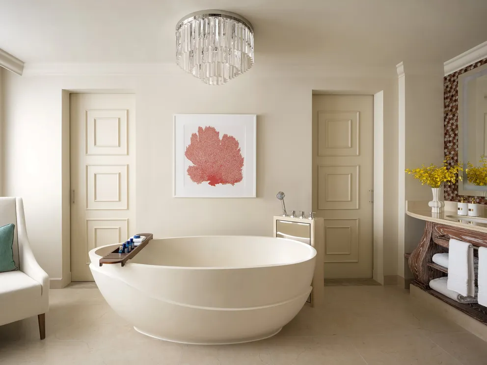 atlantis the palm skyline suite bathroom with marble finishes, spacious design and elegant luxury detailing overlooking dubai skyline