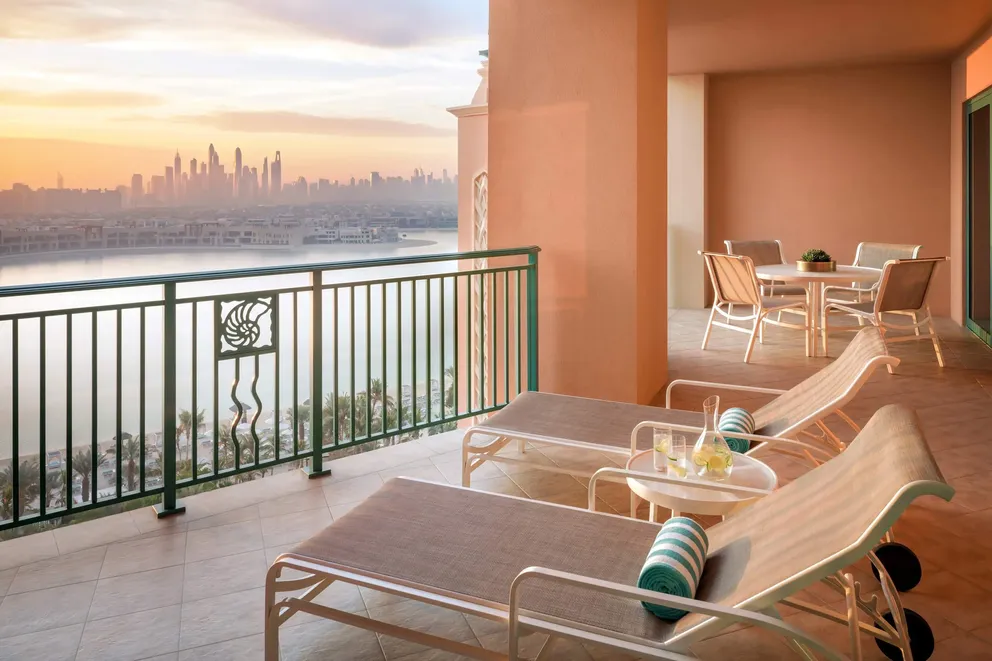 atlantis the palm terrace suite balcony with spacious outdoor seating, elegant design and sweeping views across the resort and dubai skyline
