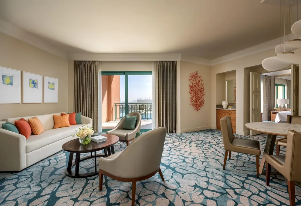 atlantis the palm terrace suite living area with spacious layout, elegant furnishings and refined luxury design overlooking dubai skyline