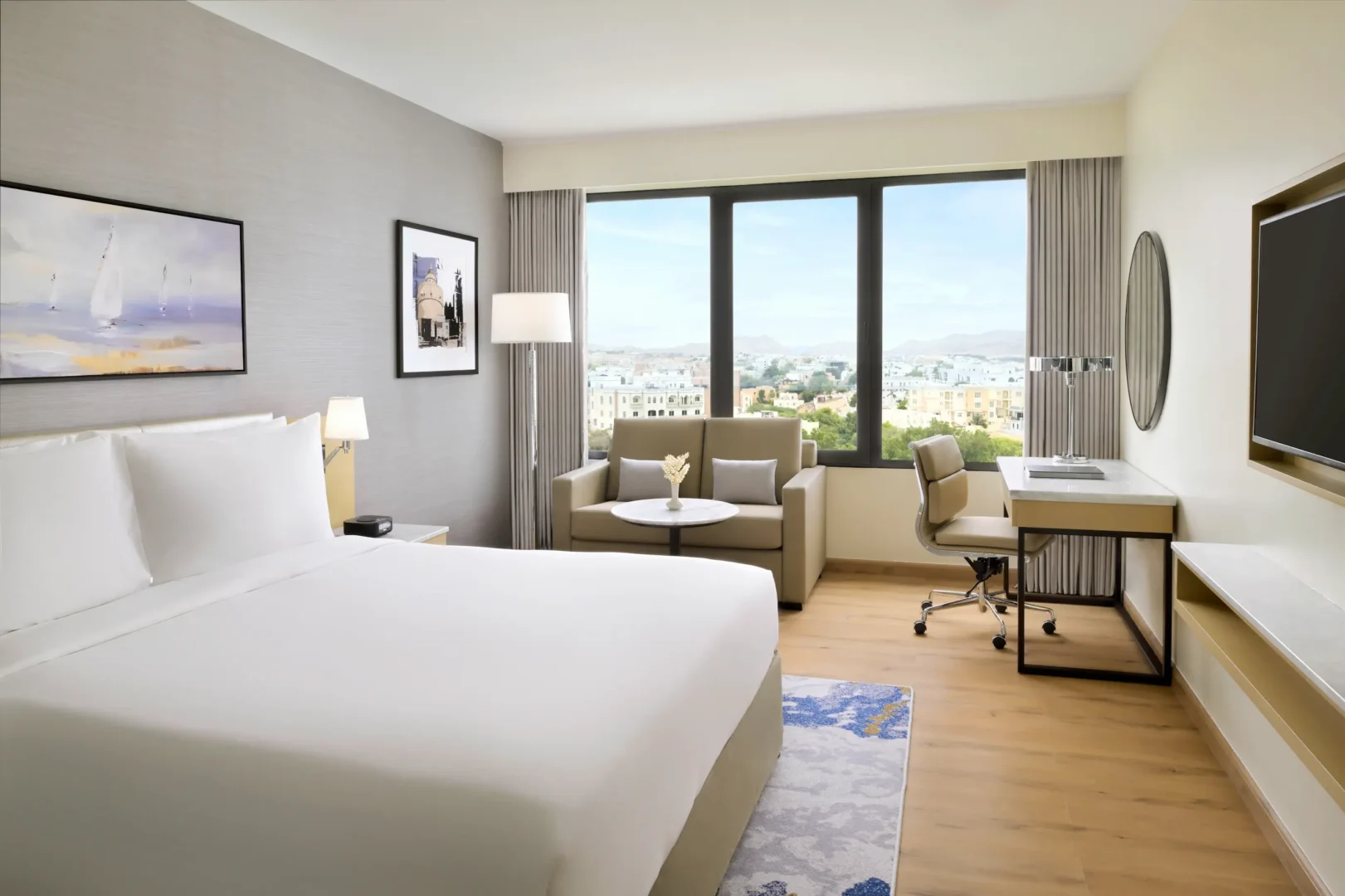 crowne plaza muscat standard city view room oman elegant interiors overlooking the city skyline