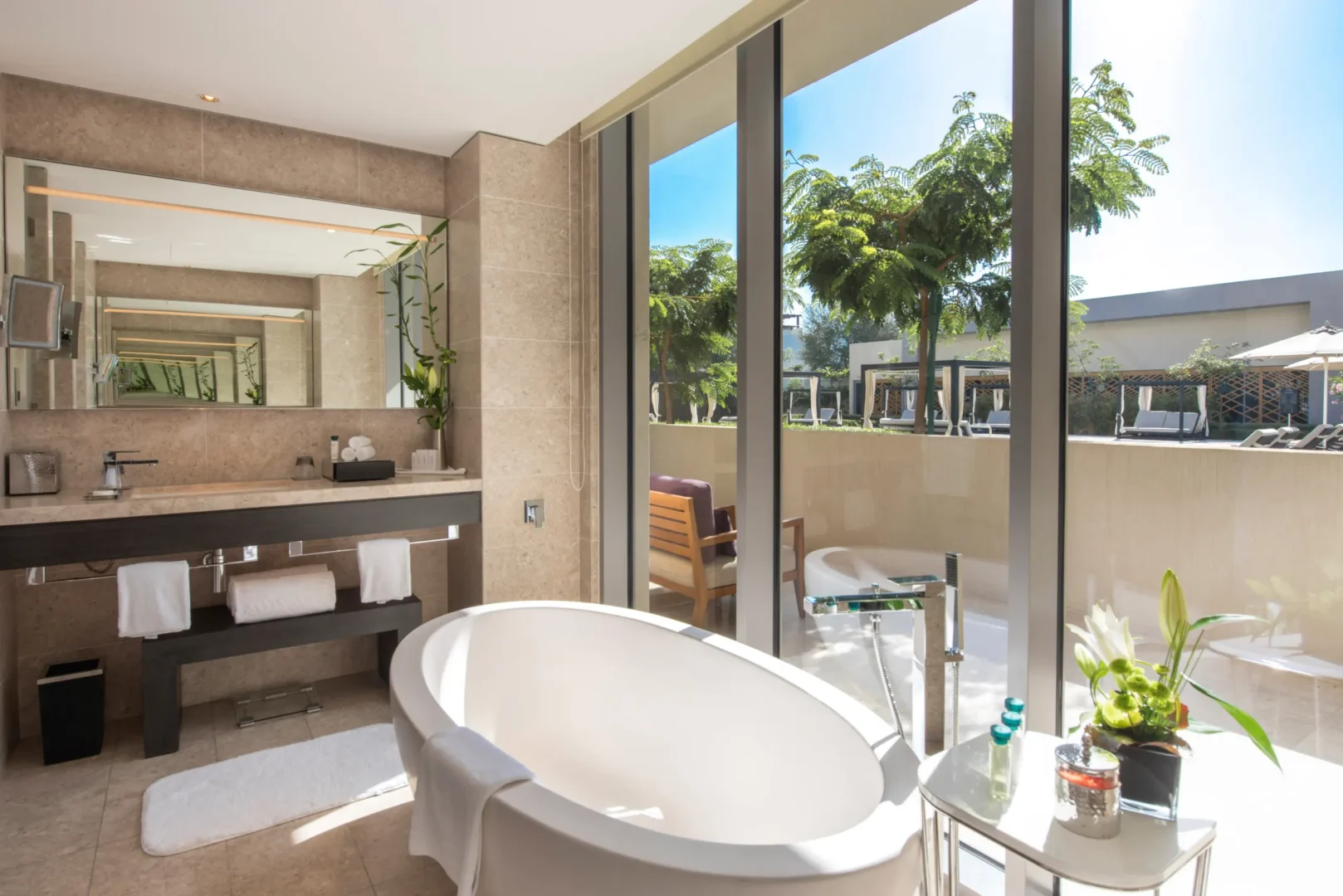 kempinski hotel muscat muscat grand deluxe resort view room bathroom with contemporary vanity and elegant interior design