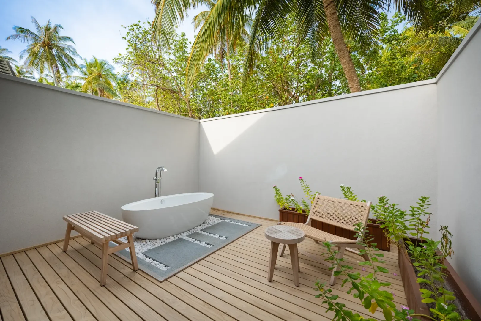 meeru maldives beach pool villa bathroom featuring open air design, elegant finishes and a tranquil island setting surrounded by tropical greenery