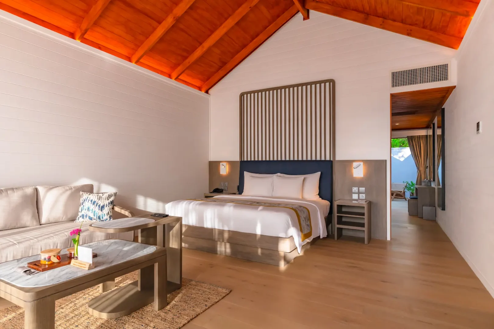 meeru maldives beach pool villa bedroom interior featuring elegant design, natural textures and serene tropical surroundings in a tranquil island setting