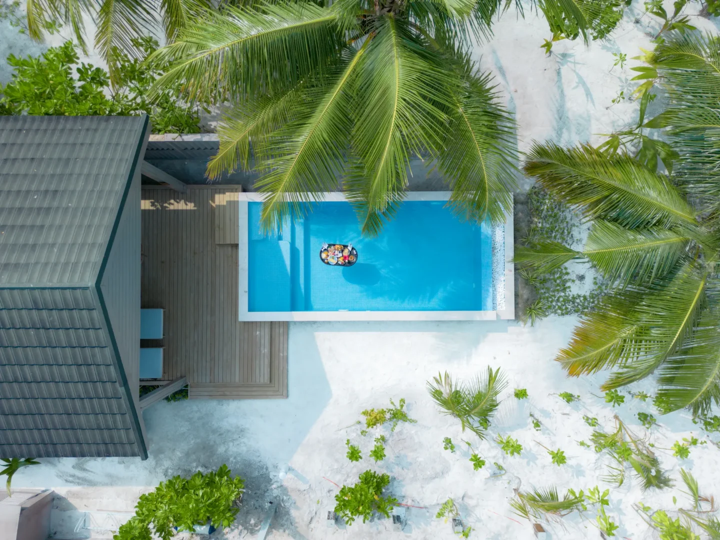 meeru maldives beach pool villa floating breakfast served in a private pool with tropical surroundings and a relaxed luxury island atmosphere