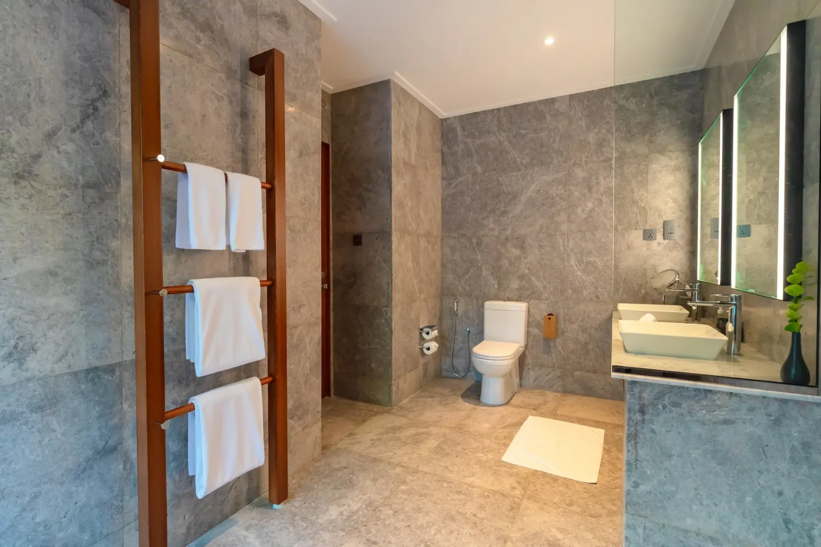 meeru maldives beach pool villa toilet featuring open air tropical design, elegant finishes and a serene island setting surrounded by lush greenery