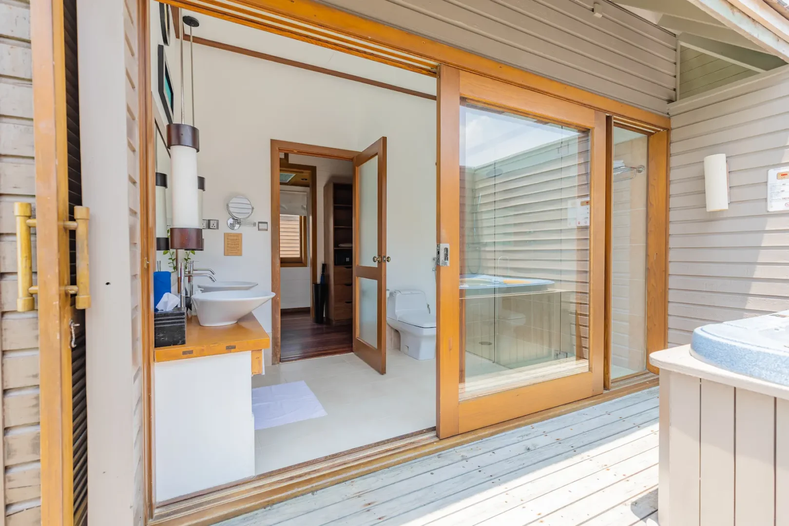 meeru maldives ocean villa bathroom featuring open plan design, elegant finishes and serene views over the turquoise lagoon in a tranquil island setting