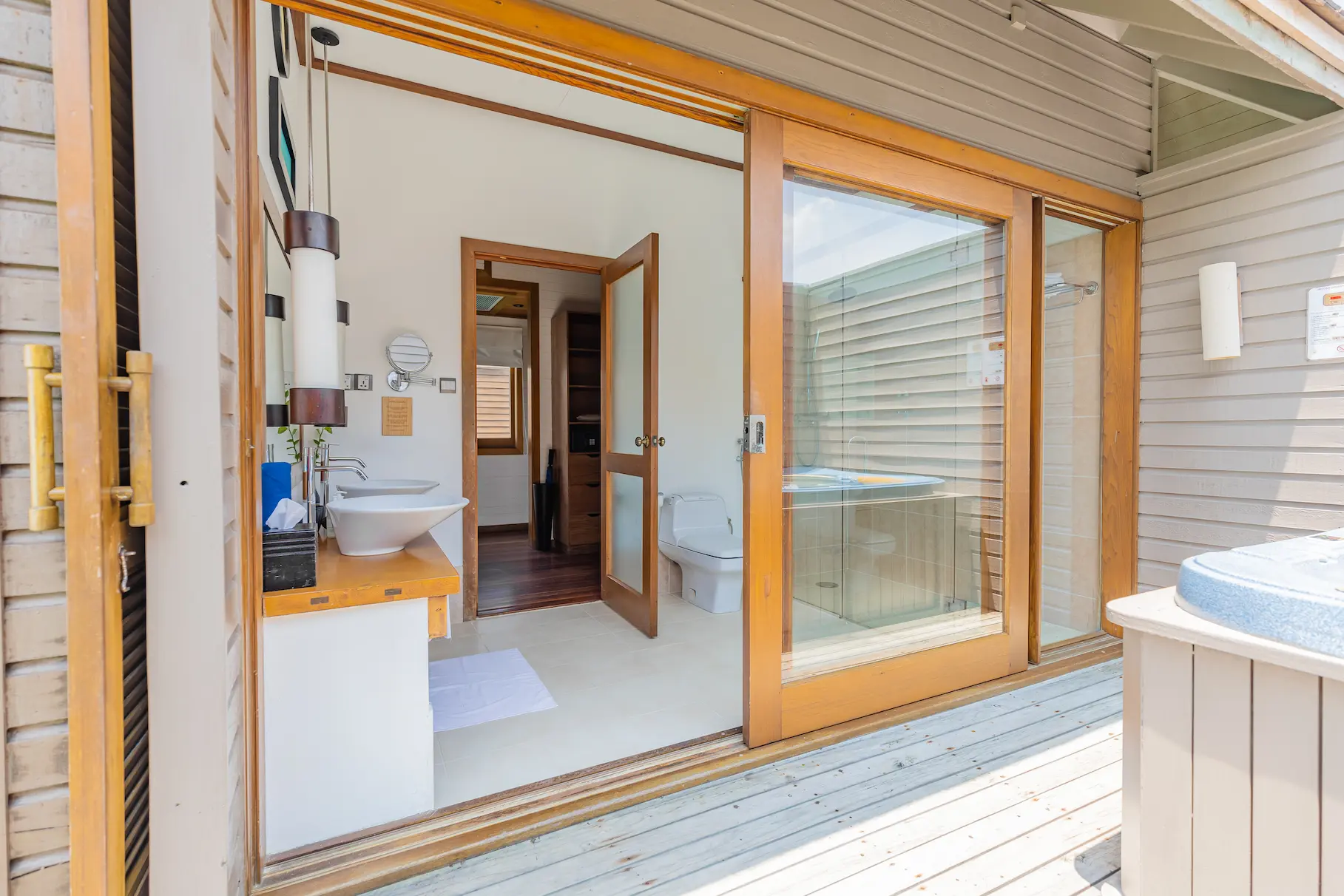 meeru maldives ocean villa bathroom featuring open plan design, elegant finishes and serene views over the turquoise lagoon in a tranquil island setting