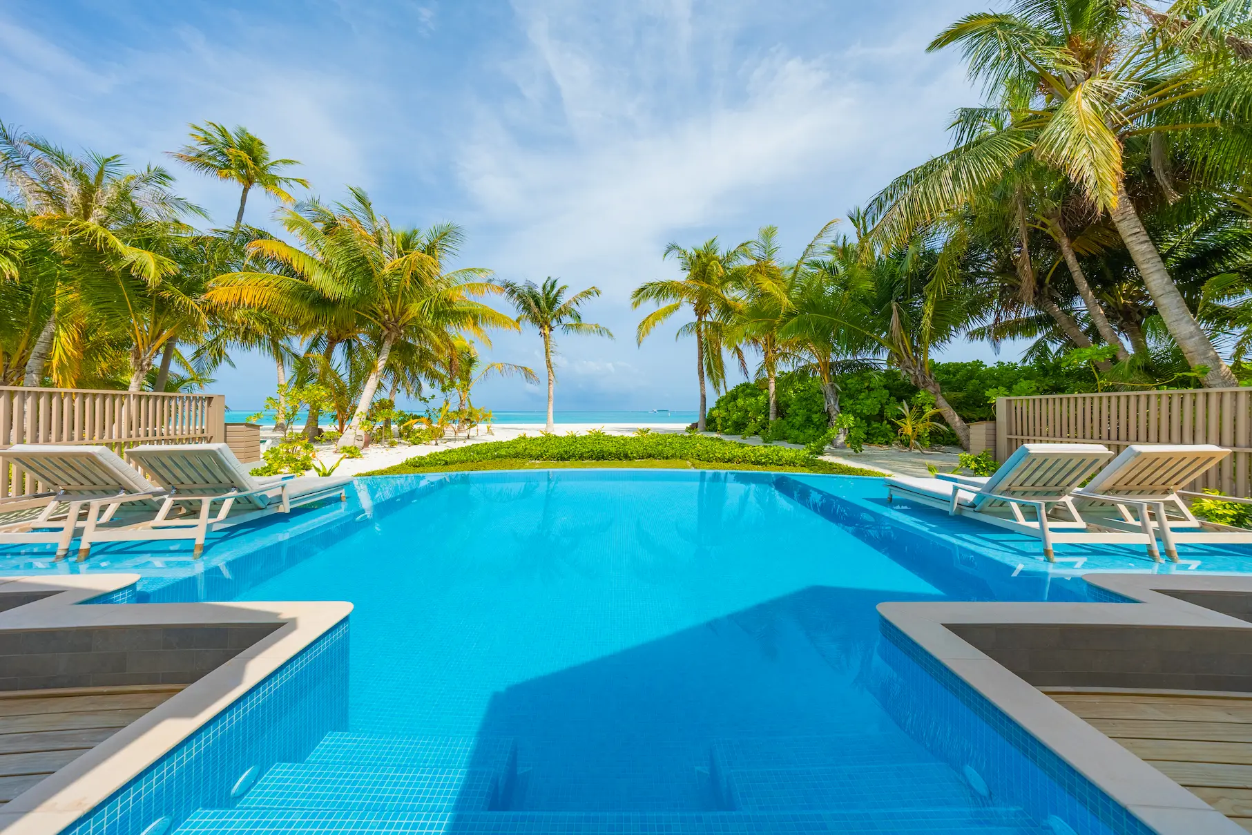 meeru maldives two bedroom beach pool villa exterior featuring private pool, direct beach access and lush tropical surroundings in a serene island setting