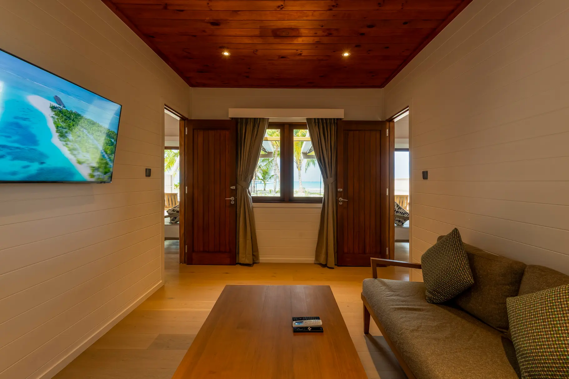 meeru maldives two bedroom beach pool villa sitting room featuring spacious layout, elegant furnishings and a relaxed tropical atmosphere in a serene island setting