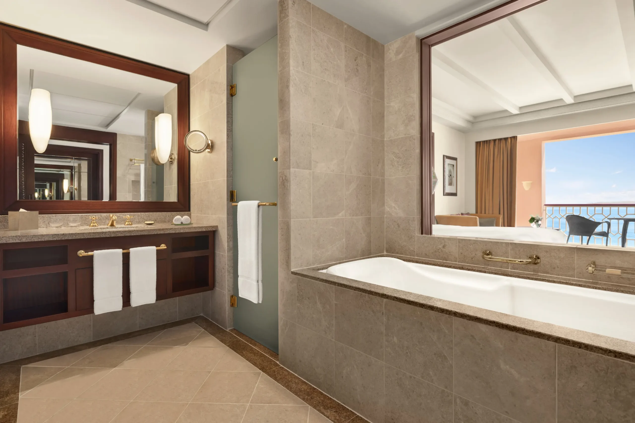oman al husn hotel muscat deluxe room with sea view bathroom featuring elegant finishes and refined coastal design