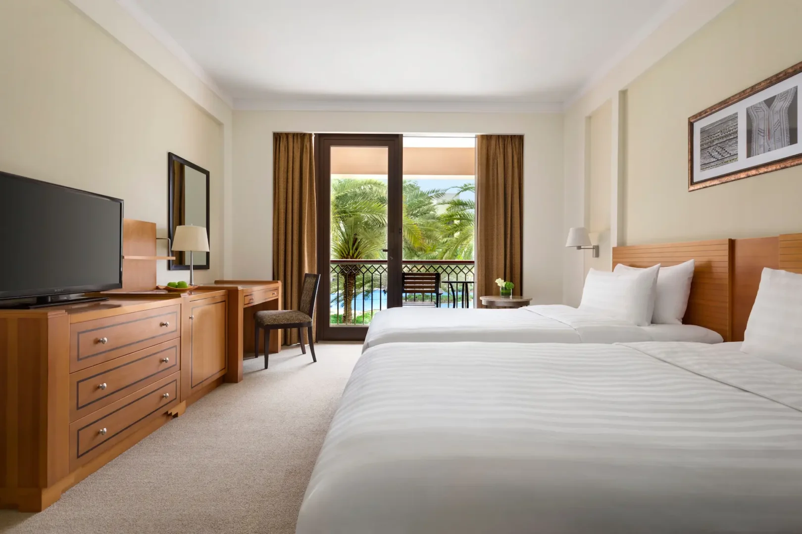 oman doubletree by hilton muscat al waha family connecting rooms balcony with spacious outdoor area and relaxed resort setting