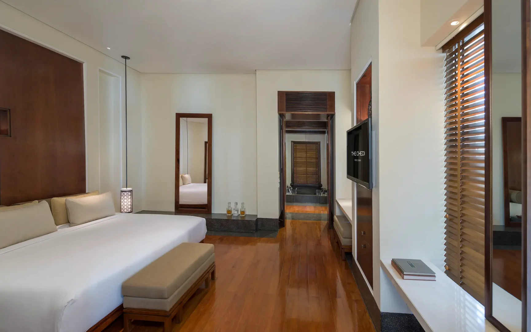 oman the chedi club suite bedroom with refined interiors and elegant contemporary design