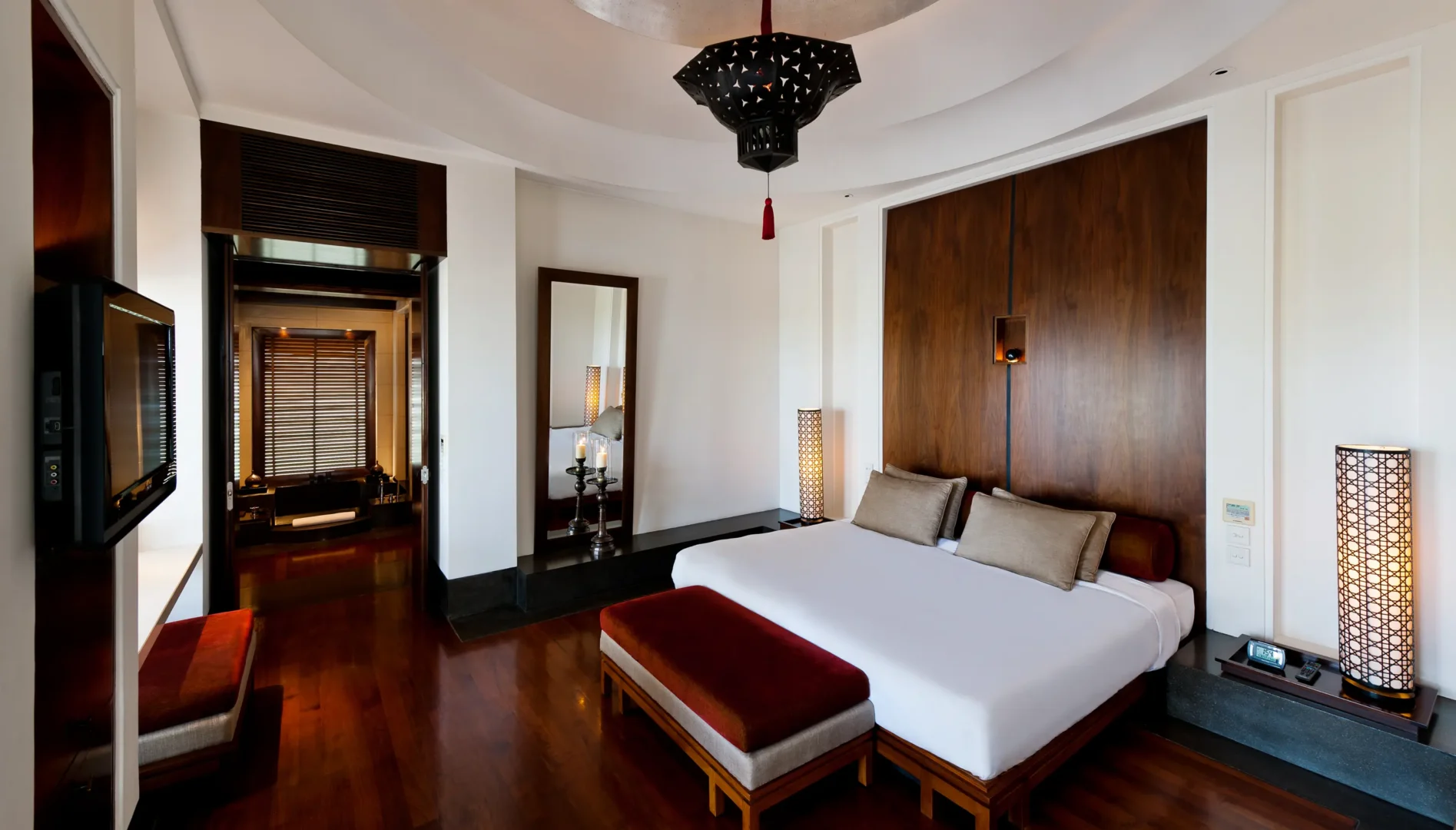 oman the chedi club suite bedroom interior with refined furnishings and elegant contemporary design