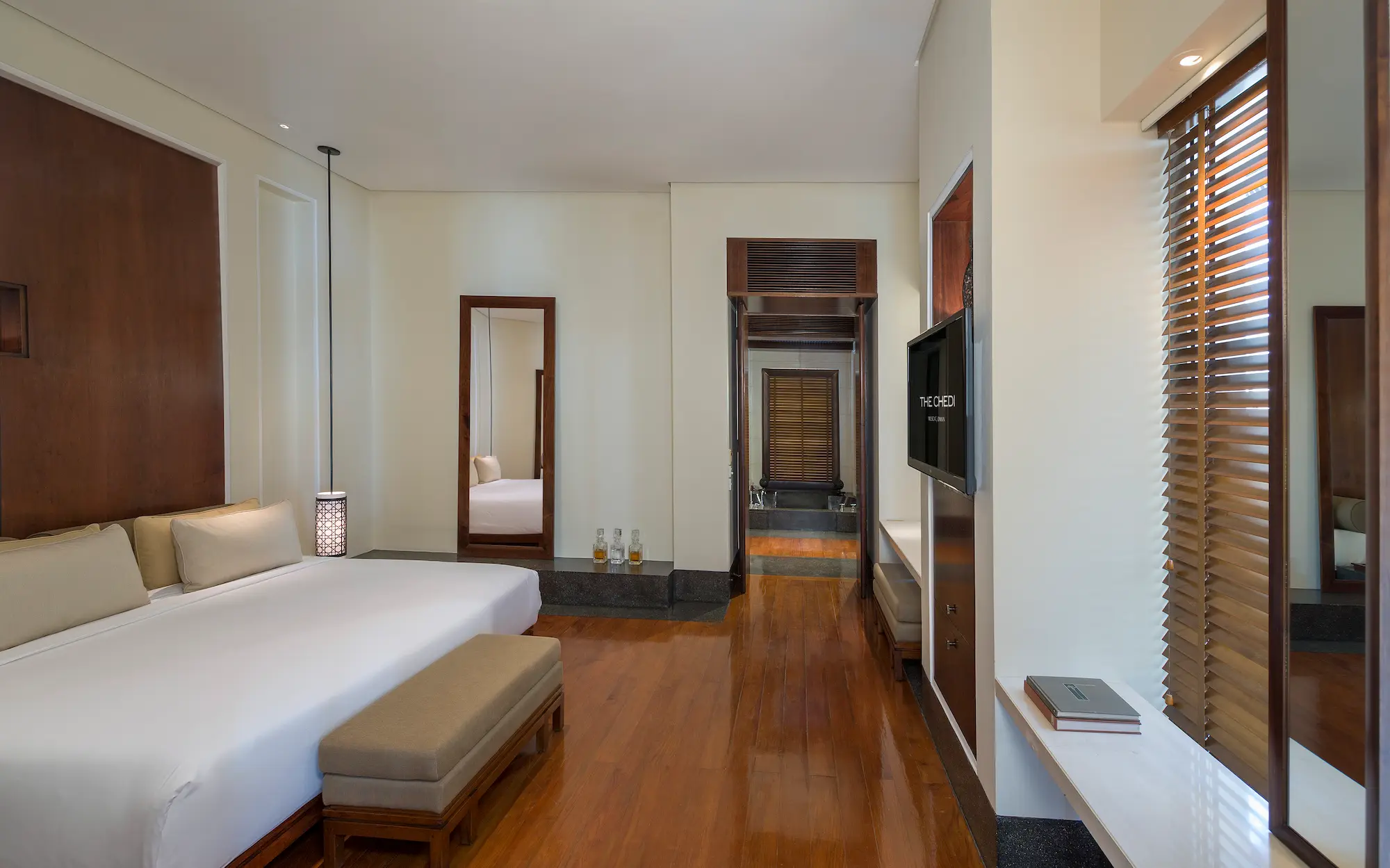 oman the chedi club suite bedroom with refined interiors and elegant contemporary design