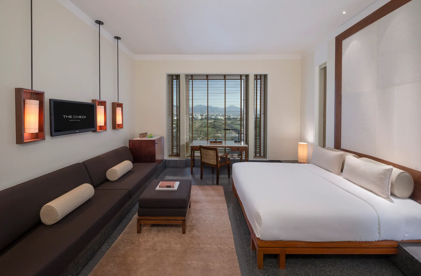 oman the chedi serai room mountain view bedroom interior with elegant heritage design