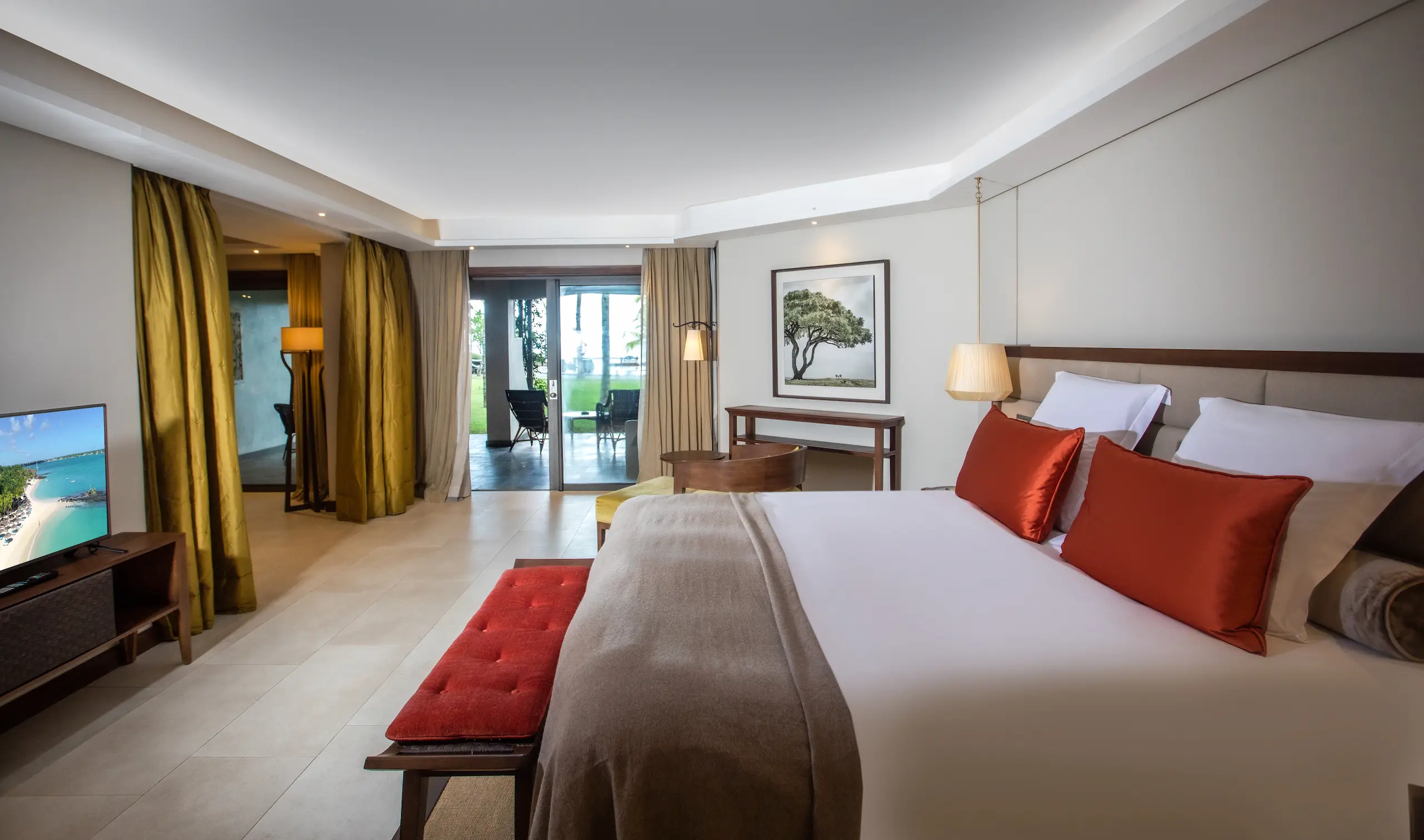 royal palm beachcomber family suite room with terrace featuring elegant interiors and outdoor relaxation space in grand baie mauritius