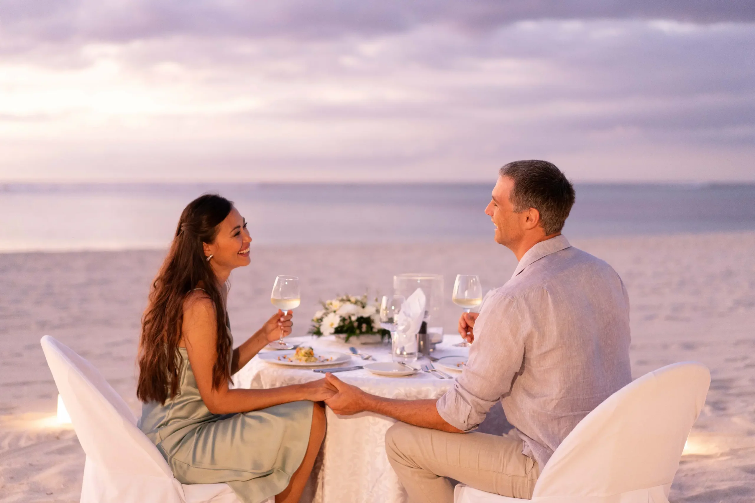 dinarobin beachcomber golf resort spa mauritius romantic dinner with an intimate beachfront dining setting at sunset