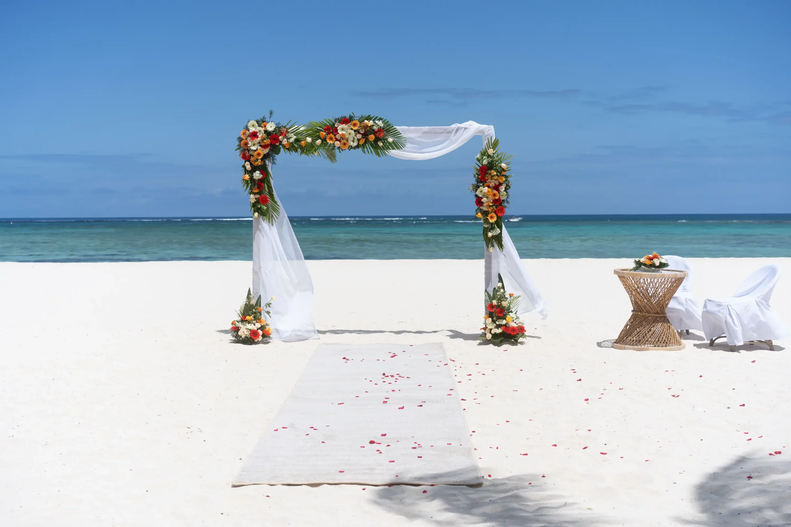 dinarobin beachcomber golf resort spa mauritius wedding setup with elegant beachfront decor and stunning ocean views