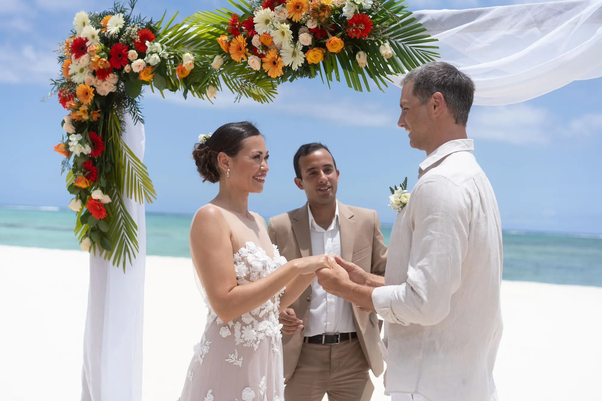 dinarobin mauritius wedding ceremony celebration with bride and groom at beachfront resort