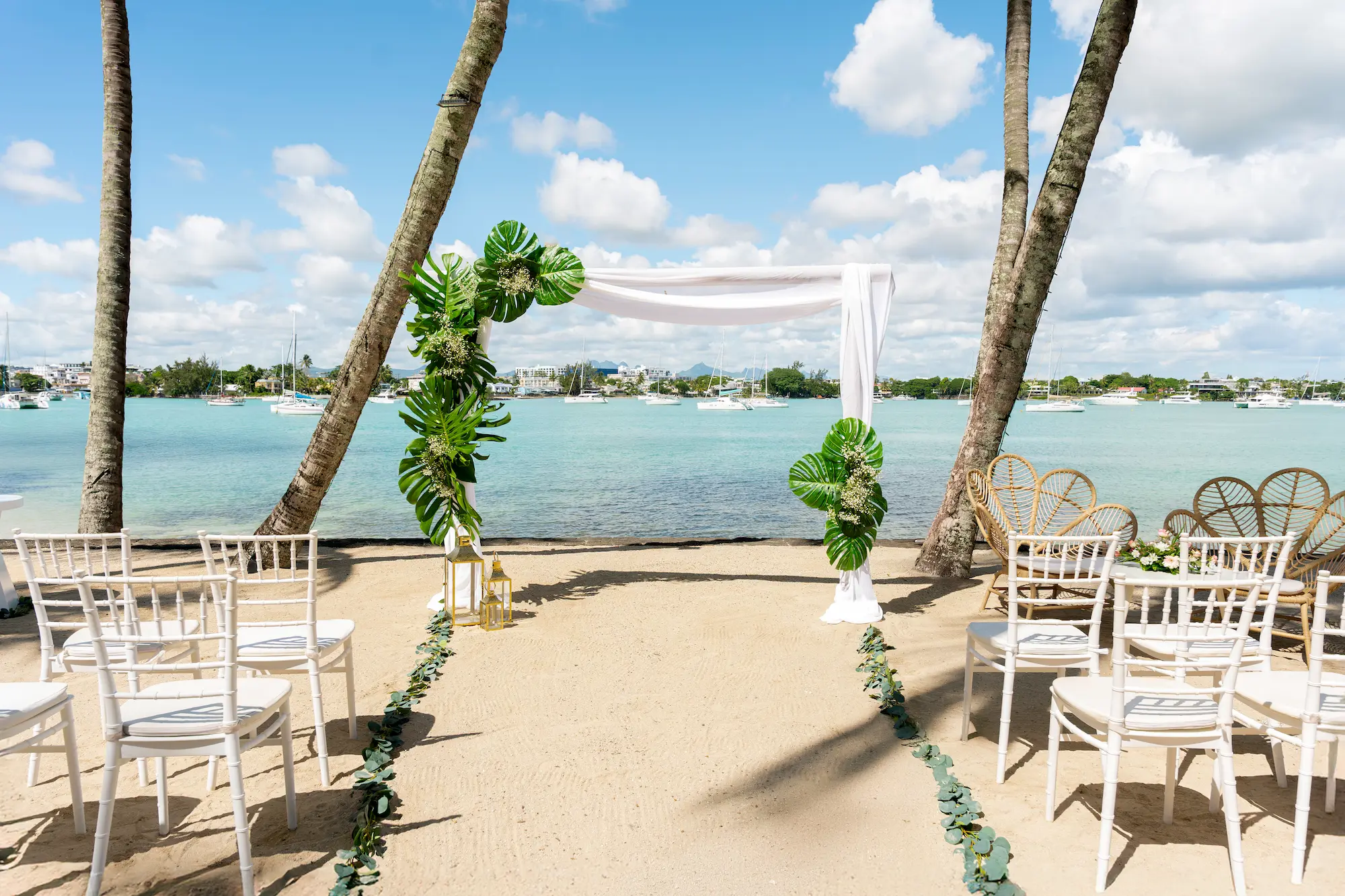 mauricia beachcomber resort spa mauritius wedding beach setup featuring elegant ceremony seating tropical floral arrangements romantic ocean views and a luxury beachfront setting for an unforgettable island celebration