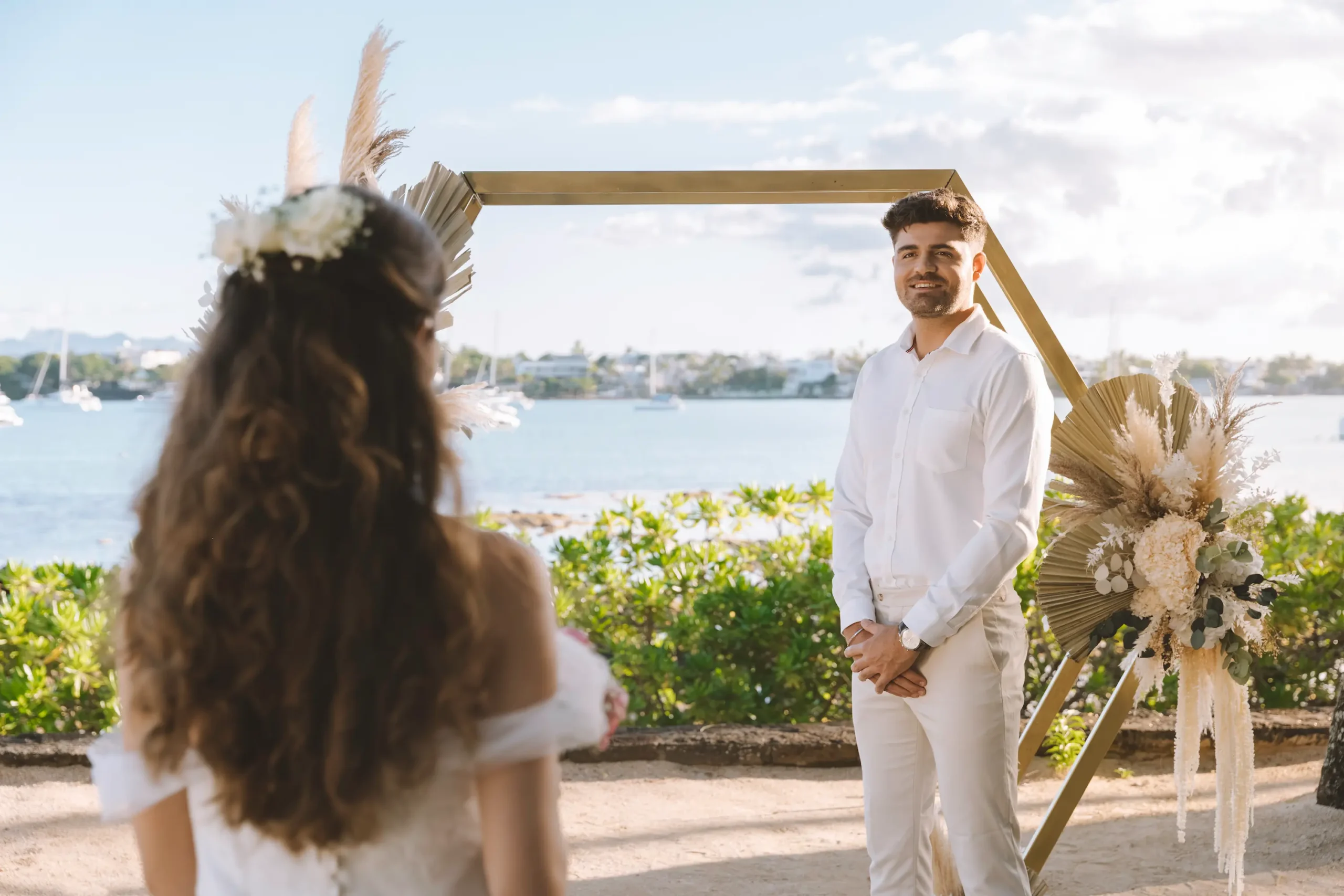 mauricia beachcomber resort spa mauritius wedding ceremony featuring a couple exchanging vows in a romantic beachfront setting surrounded by tropical scenery elegant floral décor and a luxury island atmosphere