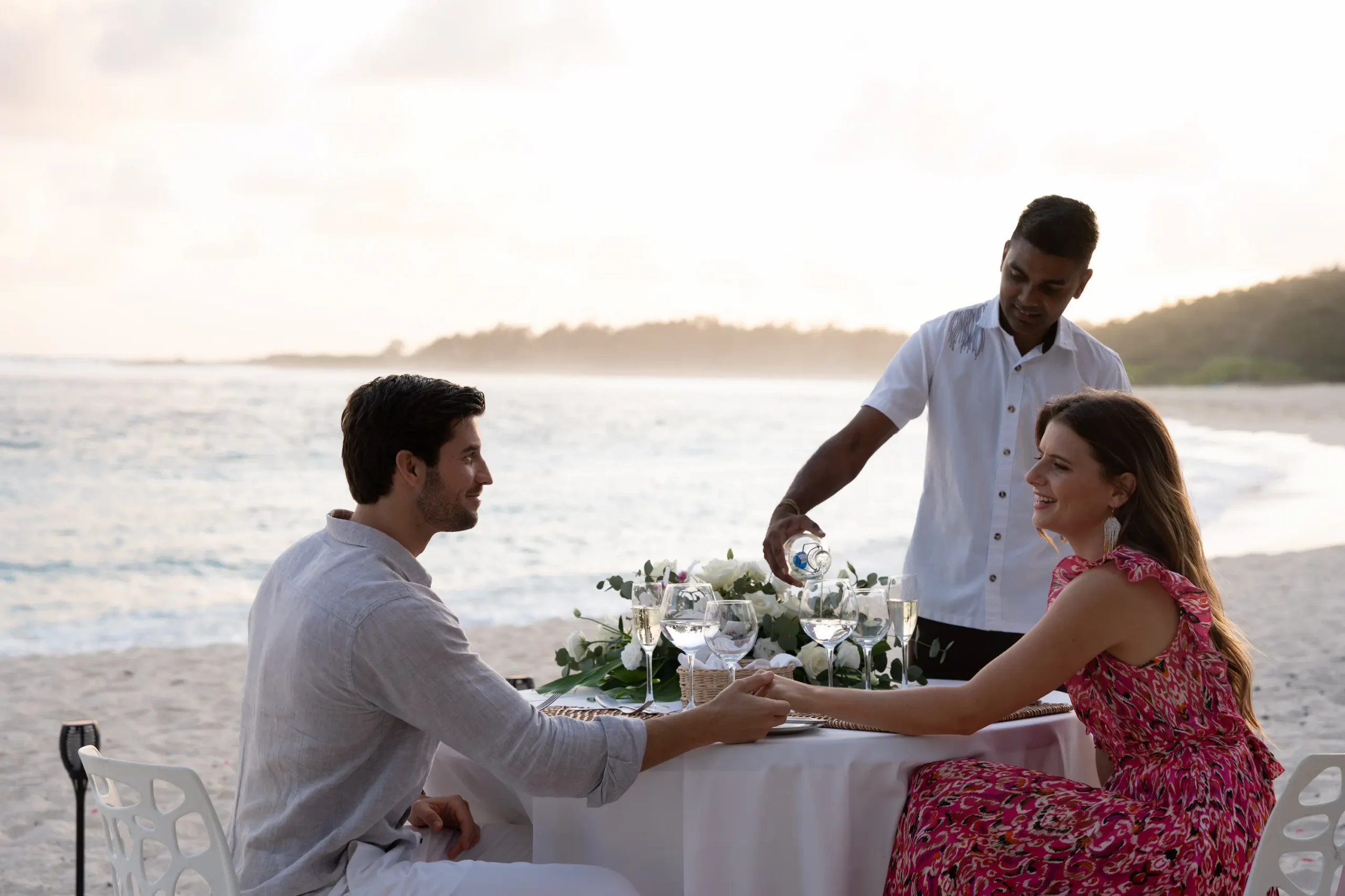 shandrani beachcomber resort spa mauritius wedding dinner with elegantly arranged tables romantic candlelight tropical floral accents and a luxury celebration dining experience by the resort waterfront