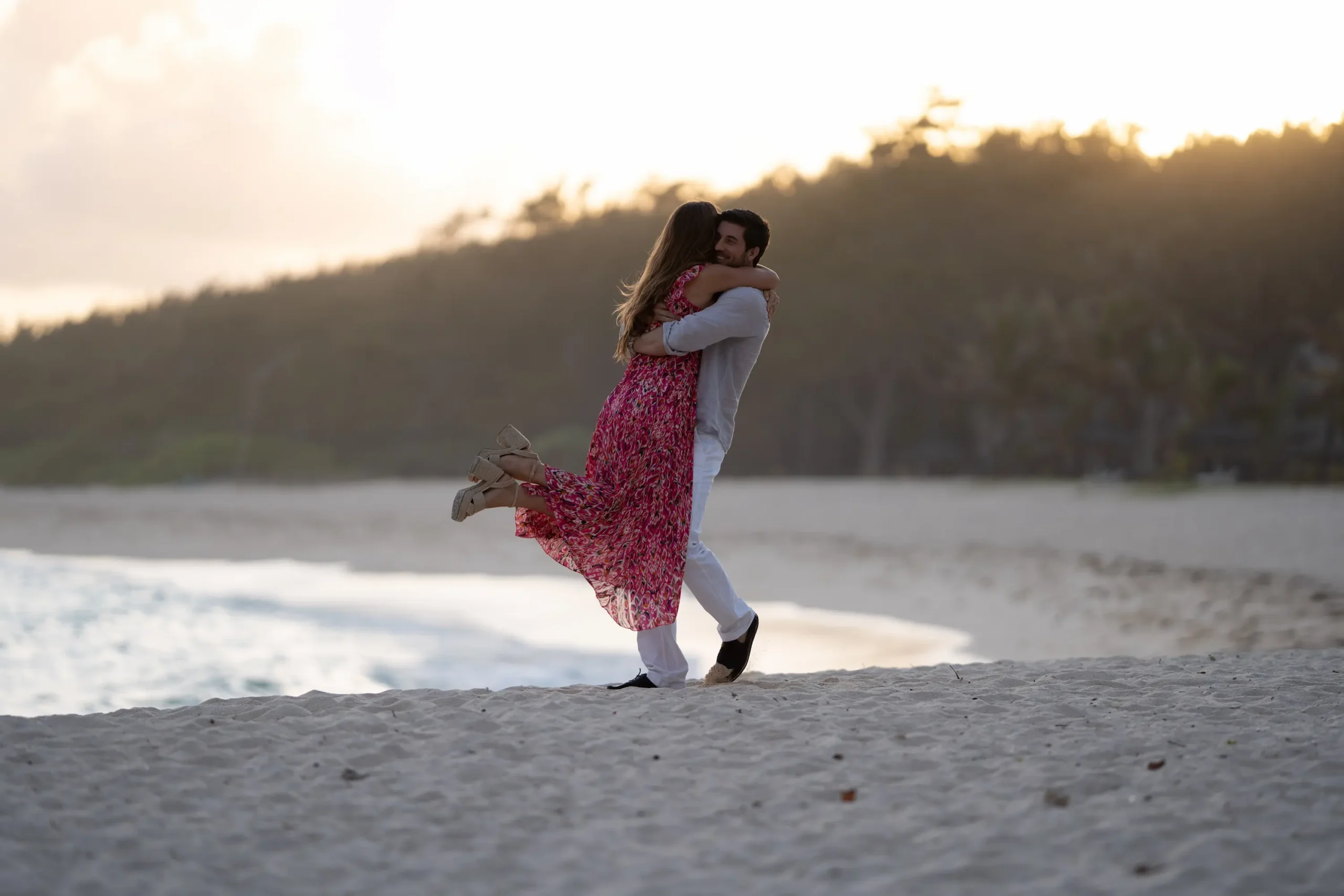 shandrani beachcomber resort spa mauritius wedding lifestyle experience featuring a newlywed couple enjoying romantic moments along the beach with elegant resort surroundings and luxury island ambiance