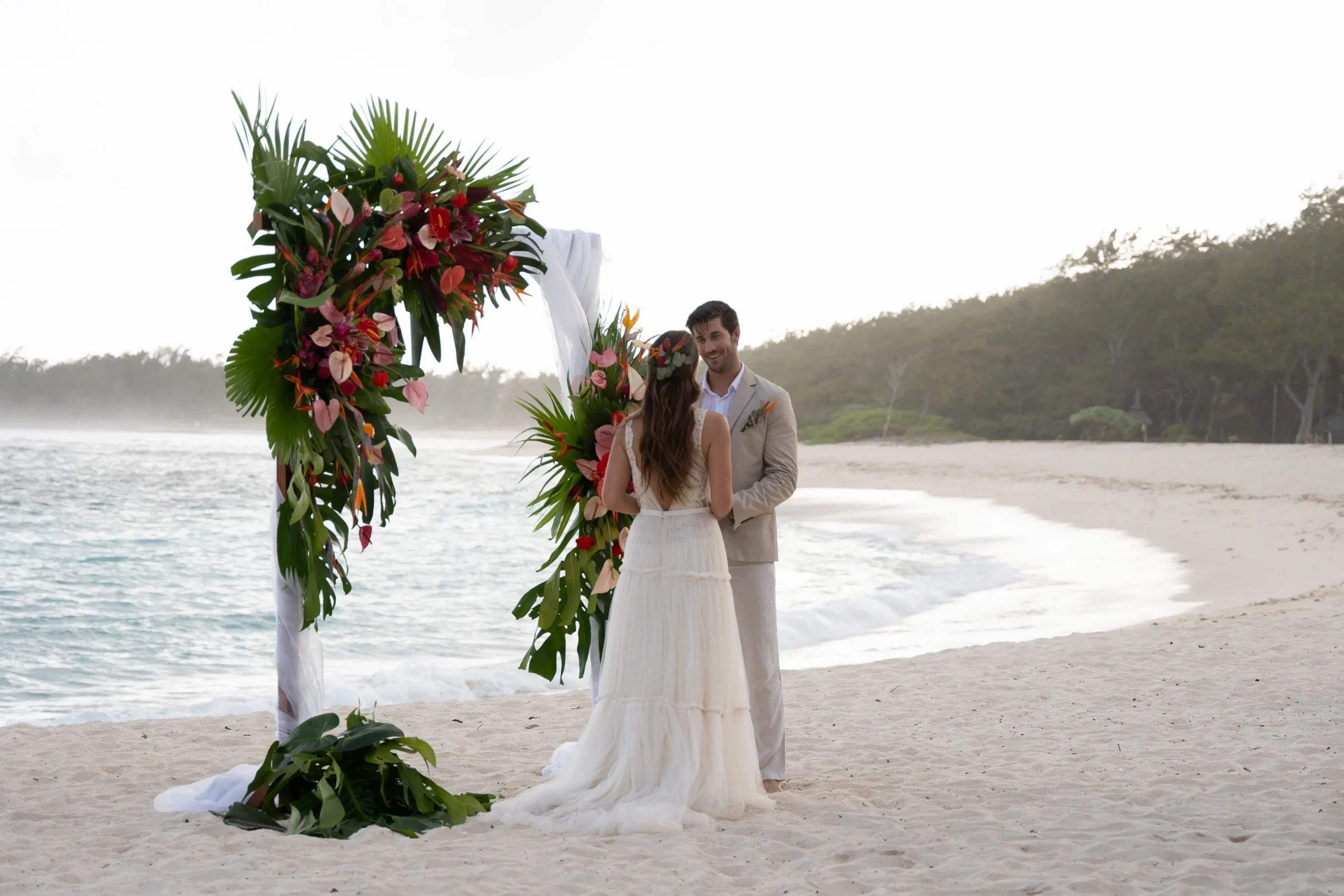 shandrani beachcomber resort spa mauritius wedding vows ceremony with a couple exchanging vows in an elegant tropical setting surrounded by luxury wedding décor and romantic island scenery