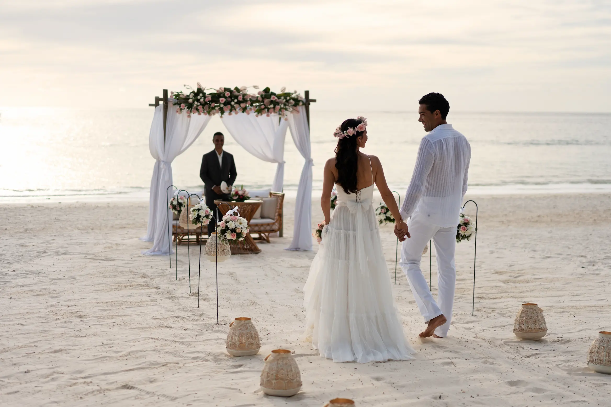 trou aux biches beachcomber golf resort spa mauritius wedding setup on the beach with elegant floral decorations romantic seaside seating and luxury oceanfront ceremony styling