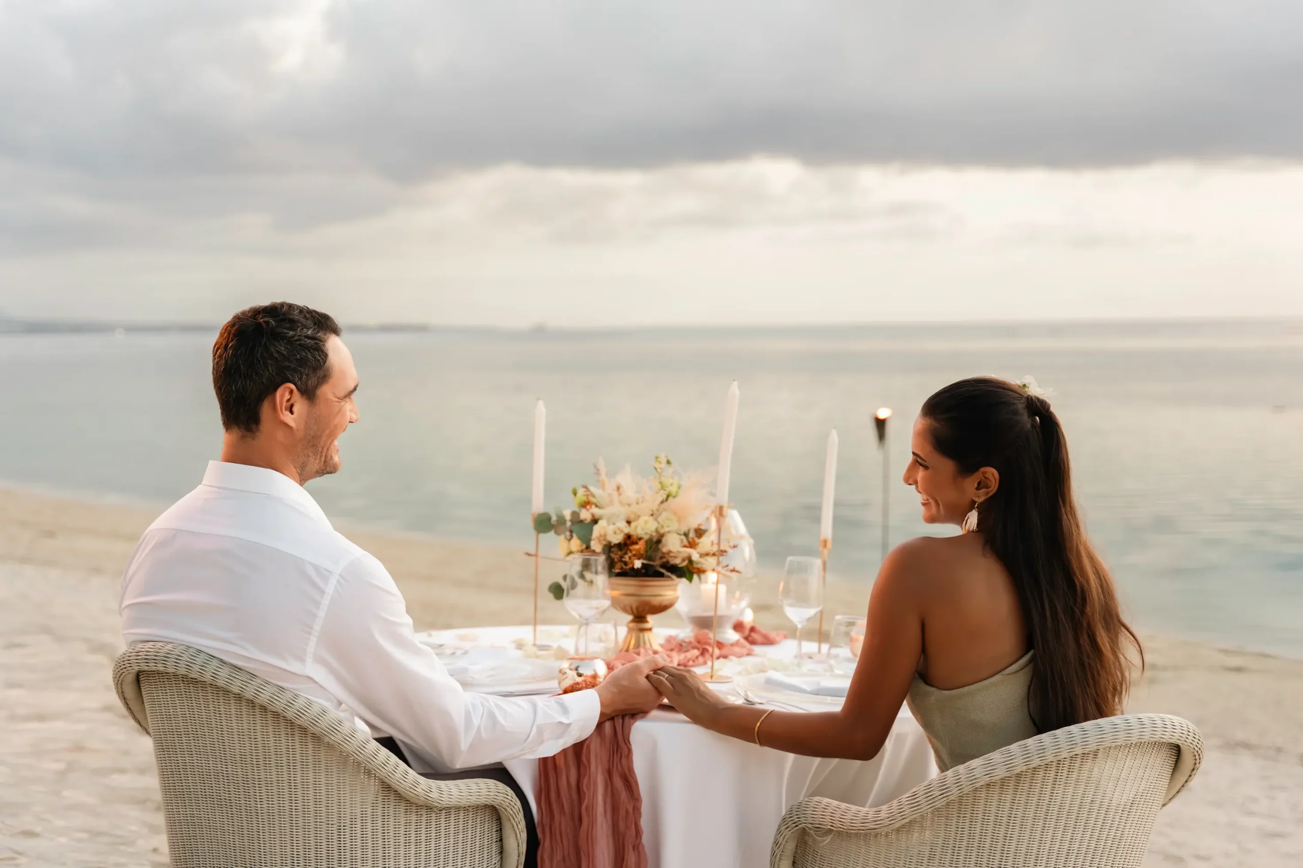 victoria beachcomber resort spa mauritius wedding dinner with elegantly styled tables romantic candlelit ambiance tropical floral decorations and a luxury beachfront celebration dining experience