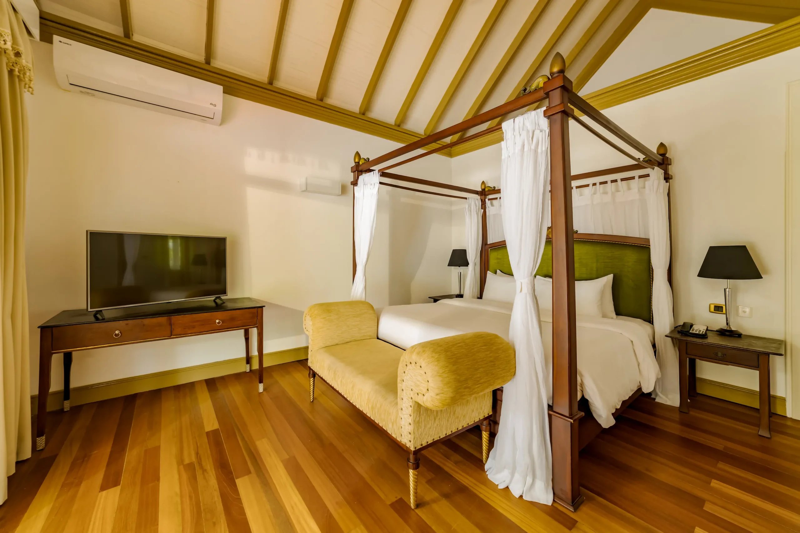 bedroom in a two bedroom beach suite at sun siyam olhuveli maldives featuring contemporary furnishings and spacious beachfront accommodation