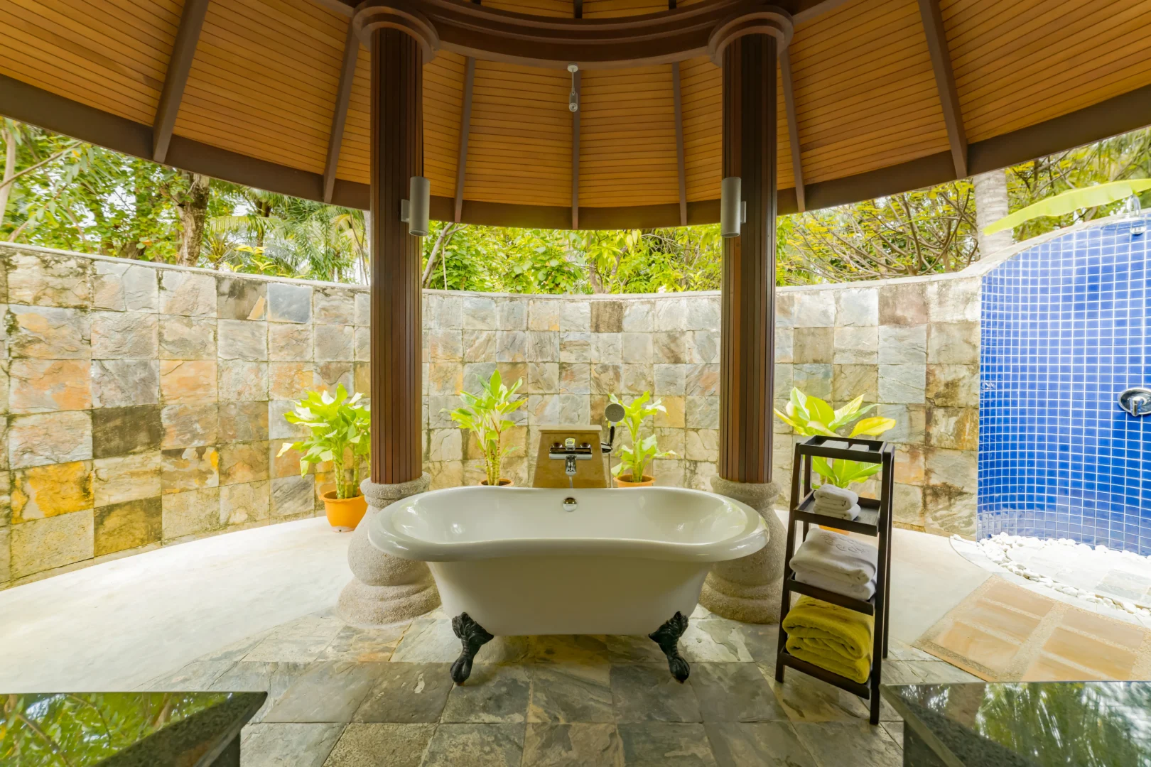 outdoor bathtub at a two bedroom beach suite at sun siyam olhuveli maldives featuring a private open air bathing area