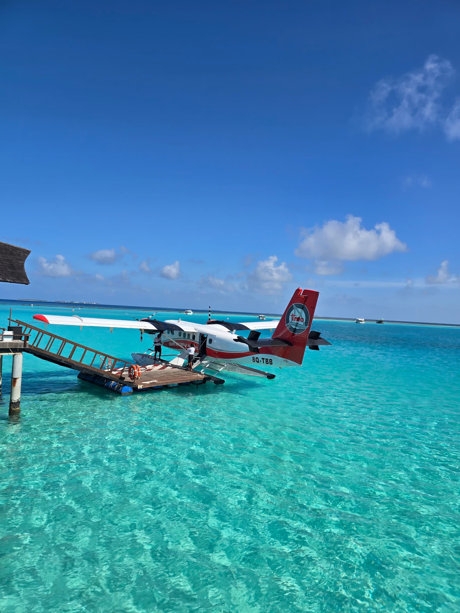 James and Natasha Oliphant from Not Just Travel arriving by seaplane, highlighting personalised travel experiences and holiday expertise.